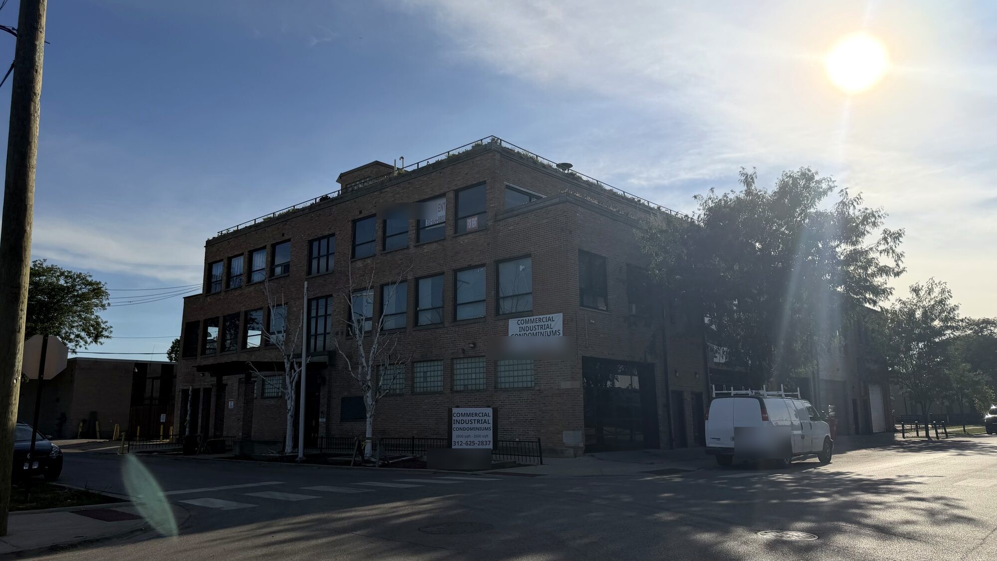 A wide view of the three-story brick loft building at 2701–09 W. Fulton St.