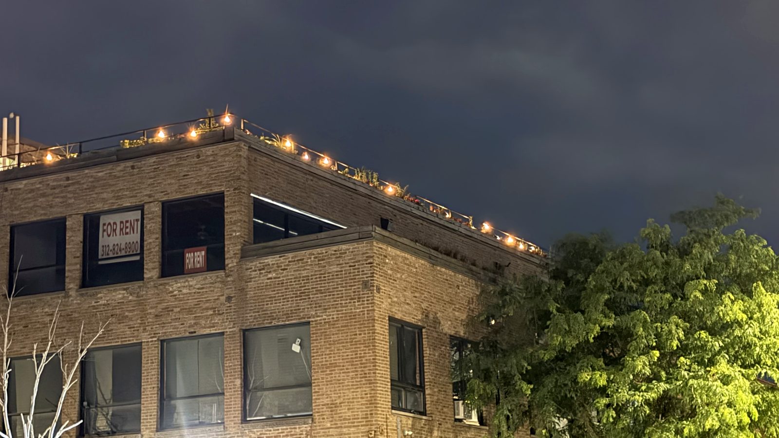 The rooftop of The Fulton Building at dusk.
